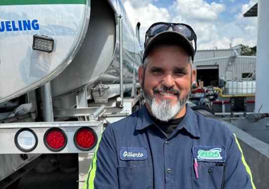 Greens' Fuel employee in work uniform