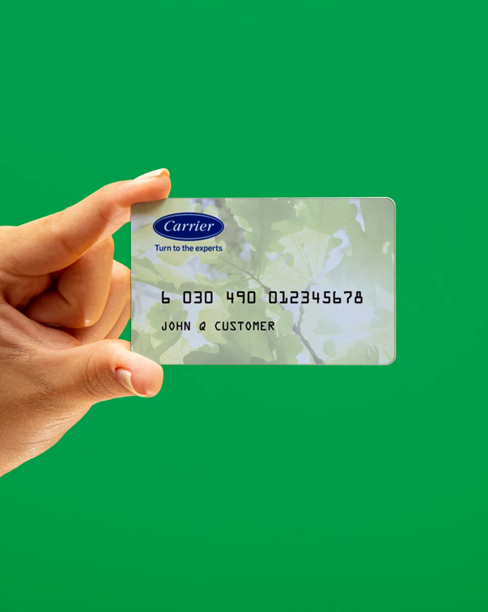 hand holding up Carrier credit card